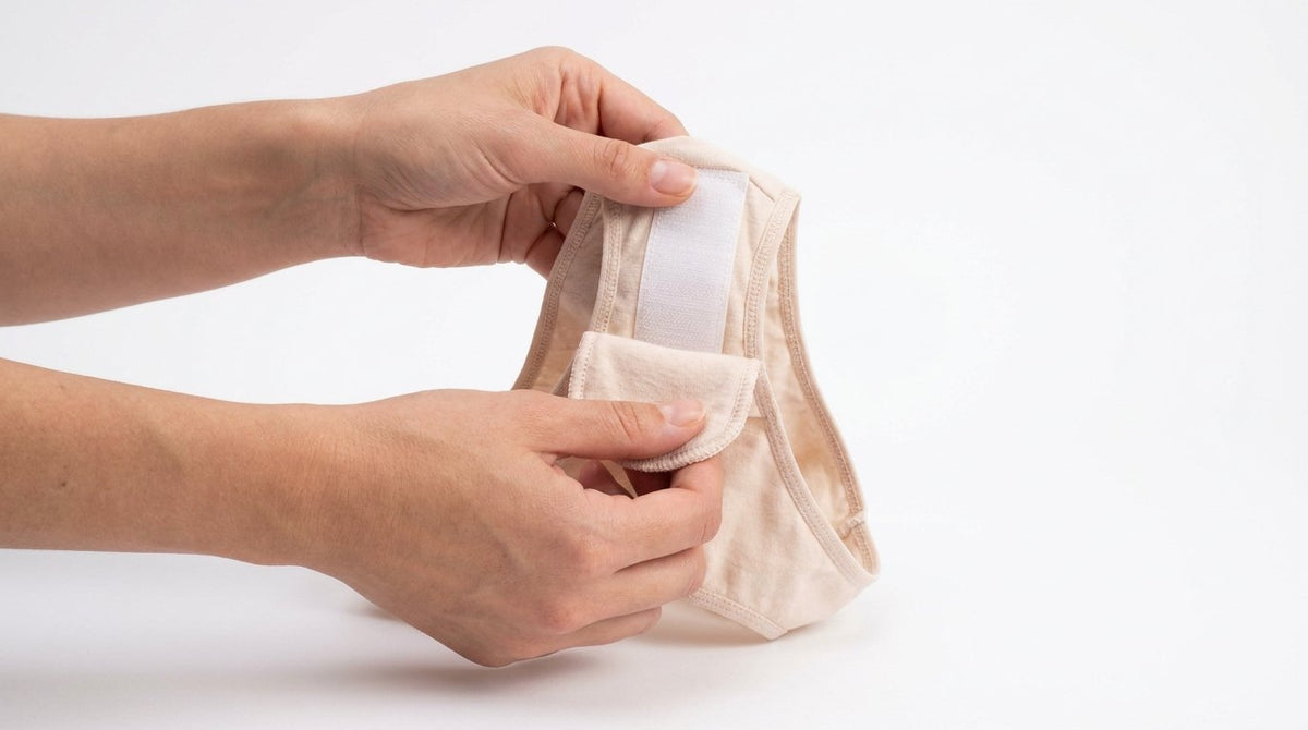 Pad velcro riutilizzabile Orykas attaccato alla culotte: sistema modulare